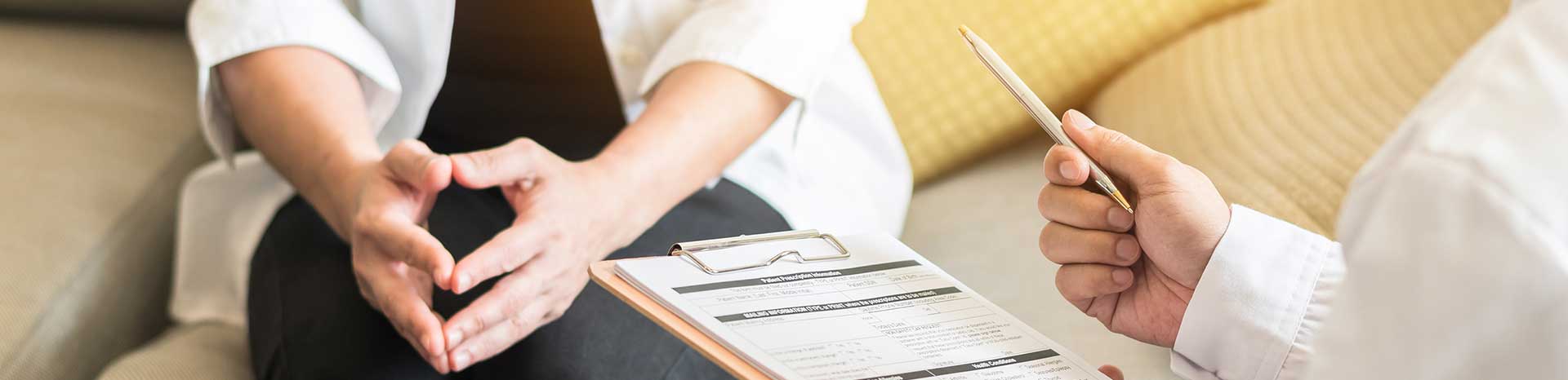 Person consulting with a doctor for a research study. Contact FutureSearch for more information on a Smoking Cessation Research Study in Dallas, Texas.