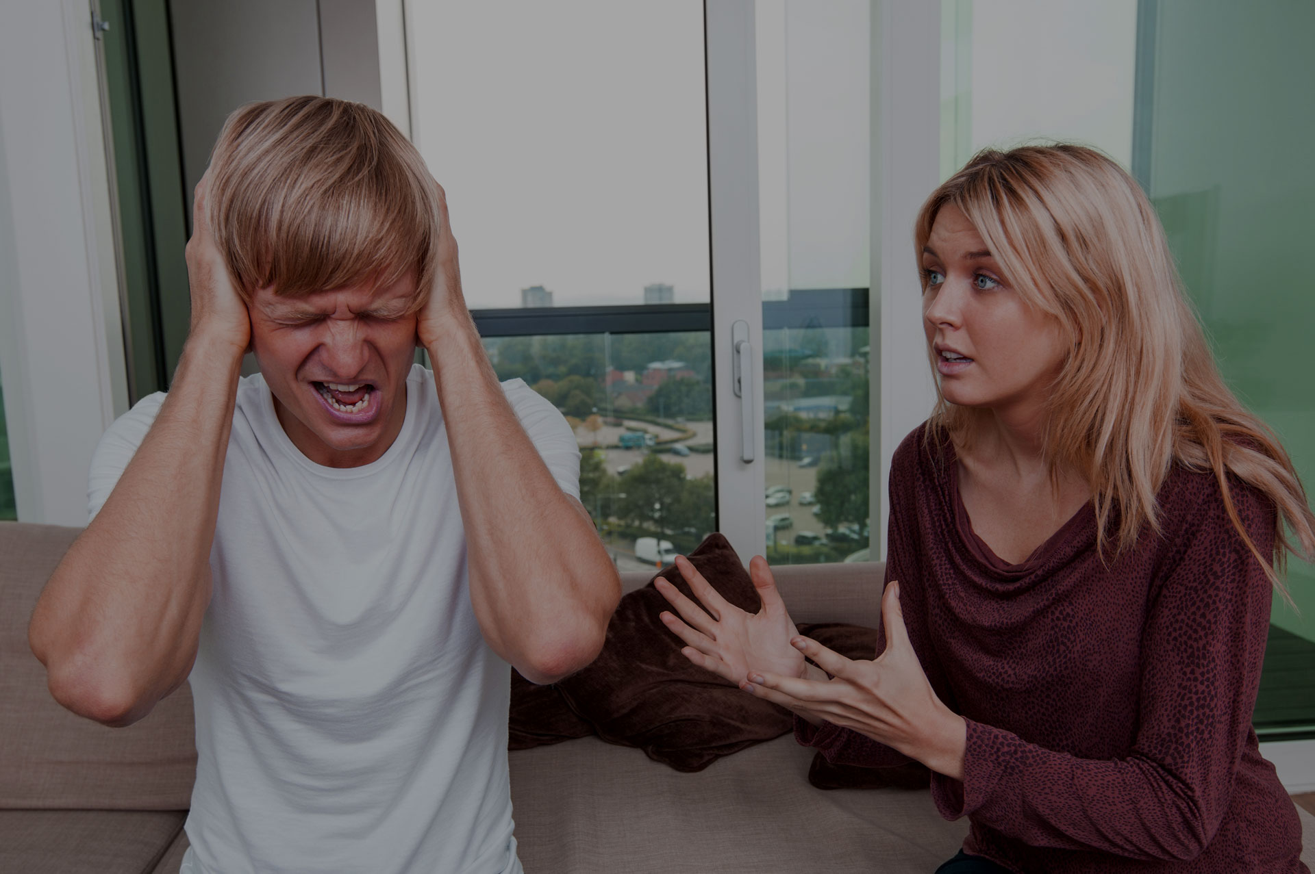 FutureSearch Trials PTSD Research Study in Dallas Texas. Man upset holding his head while woman is surprised looking at him.