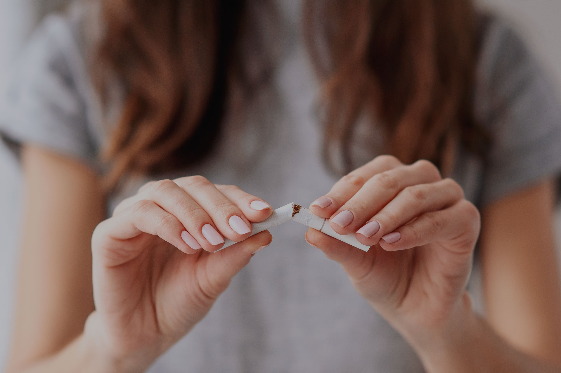 Future Search Trials Smoking Cessation Study FSTrials Woman Breaking Cigarette and quitting.